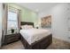 Bedroom features wood-look flooring, neutral wall color, and bright natural light at 8012 Lost Shaker Ln, Kissimmee, FL 34747