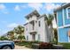 Charming two-story home with a balcony and landscaped yard, perfect for enjoying the coastal lifestyle at 8012 Lost Shaker Ln, Kissimmee, FL 34747