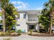 This home boasts a spacious brick patio, outdoor seating, balcony and mature landscaping at 8012 Lost Shaker Ln, Kissimmee, FL 34747