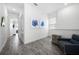 Sitting area in hallway features wood-look tile flooring and bright natural light at 8012 Lost Shaker Ln, Kissimmee, FL 34747