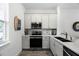 Bright kitchen showcases white cabinetry, stainless steel appliances, and elegant countertops at 8012 Lost Shaker Ln, Kissimmee, FL 34747