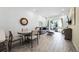Spacious living room features tile flooring, comfortable seating, and sliding glass doors to the outside at 8012 Lost Shaker Ln, Kissimmee, FL 34747