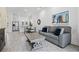 Inviting living area with an open floor plan, seamlessly connected to the modern kitchen and dining space at 8012 Lost Shaker Ln, Kissimmee, FL 34747