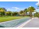 Picturesque recreation area with a shuffleboard court, playground, and lush landscaping, offering outdoor enjoyment at 8012 Lost Shaker Ln, Kissimmee, FL 34747