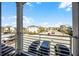 Balcony view of the community featuring parking, green spaces, and other neighborhood homes at 8012 Lost Shaker Ln, Kissimmee, FL 34747