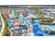 Thrilling water park featuring colorful slides and pools, set against a backdrop of lush landscaping and clear blue skies at 8012 Lost Shaker Ln, Kissimmee, FL 34747