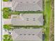 Aerial view of home rooftops with brick paved driveways and lush landscaping at 806 Via Como St, Poinciana, FL 34759