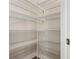 Walk-in pantry with metal shelving providing ample storage space at 806 Via Como St, Poinciana, FL 34759