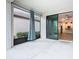 Screened patio with interior view of the kitchen through a sliding glass door at 806 Via Como St, Poinciana, FL 34759