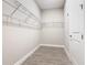 Walk-in closet with wood-look tile flooring and wire shelving at 806 Via Como St, Poinciana, FL 34759