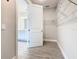 Walk-in closet with view of bathroom with double sinks at 806 Via Como St, Poinciana, FL 34759