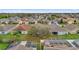 Birds eye view of the neighborhood, showcasing fenced yards and screened-in pools at 923 Tramells Trl, Kissimmee, FL 34744