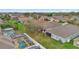 An aerial view of backyard pool and patio in residential neighborhood at 923 Tramells Trl, Kissimmee, FL 34744