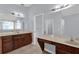 Bright bathroom with dual vanities and a makeup counter, offering ample space and storage at 923 Tramells Trl, Kissimmee, FL 34744