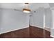 Dining room showcasing hardwood floors and modern light fixture at 923 Tramells Trl, Kissimmee, FL 34744