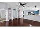 Spacious open-concept living area flows to modern kitchen and features built-in shelving at 923 Tramells Trl, Kissimmee, FL 34744