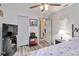 Bedroom with a comfortable bed, TV, ceiling fan, and storage space at 9559 Dubois Blvd, Orlando, FL 32825