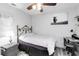 Small bedroom with a comfortable bed, desk, and modern decor at 9559 Dubois Blvd, Orlando, FL 32825