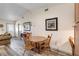 Cozy dining area featuring wood floors and a rustic wooden table with chairs at 9559 Dubois Blvd, Orlando, FL 32825