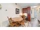 Cozy dining area featuring wood floors and a rustic wooden table with chairs at 9559 Dubois Blvd, Orlando, FL 32825