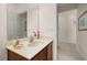 Bathroom with a large mirror and a single sink with a marble counter at 113 Tiger Lily Ct, Davenport, FL 33837