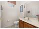 Cozy half-bath features neutral tile, single sink, and a toilet at 113 Tiger Lily Ct, Davenport, FL 33837