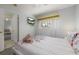 Comfortable bedroom featuring a mounted TV and a view into another room at 113 Tiger Lily Ct, Davenport, FL 33837