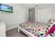 Comfortable bedroom with a television and closet offering a cozy and private space at 113 Tiger Lily Ct, Davenport, FL 33837