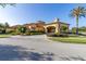 Exterior view of the Watersong clubhouse featuring classic architecture and surrounded by landscaped grounds at 113 Tiger Lily Ct, Davenport, FL 33837