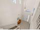 This two-story entryway features tile floors, white walls and stairs leading to the second floor at 113 Tiger Lily Ct, Davenport, FL 33837