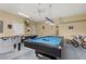Game room featuring pool table, foosball, air hockey and two bicycles at 113 Tiger Lily Ct, Davenport, FL 33837