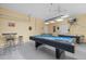 Entertainment haven featuring a blue felt pool table, air hockey, and foosball at 113 Tiger Lily Ct, Davenport, FL 33837