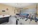 Spacious game room with air hockey, foosball table, and pool table for ultimate entertainment at 113 Tiger Lily Ct, Davenport, FL 33837