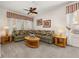Cozy living room with plush carpet, fan, and ample natural light at 113 Tiger Lily Ct, Davenport, FL 33837