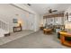 Bright living room featuring a neutral color palette, plush seating, and a ceiling fan at 113 Tiger Lily Ct, Davenport, FL 33837