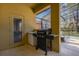 Outdoor patio includes a built-in grilling area and access to the screened-in pool at 113 Tiger Lily Ct, Davenport, FL 33837