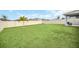 A beautiful fenced backyard with a well-maintained lawn, perfect for outdoor activities and relaxation at 1185 Catskill Dr, Haines City, FL 33844