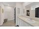 Well-lit bathroom features a large mirror, white vanity, and ample counter space at 1185 Catskill Dr, Haines City, FL 33844