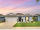 Charming single-story home with well-manicured lawn, lovely landscaping, and a two-car garage at 1185 Catskill Dr, Haines City, FL 33844