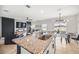 Kitchen island with granite counters and views to the living area at 1185 Catskill Dr, Haines City, FL 33844