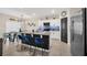 Kitchen island with granite countertops, stainless steel appliances, and modern lighting at 1185 Catskill Dr, Haines City, FL 33844