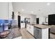 Open kitchen with granite counters, stainless appliances, tile flooring and a view of the living area at 1185 Catskill Dr, Haines City, FL 33844