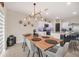 Open concept kitchen and dining area with granite countertops and stainless steel appliances at 1185 Catskill Dr, Haines City, FL 33844