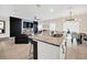 Modern kitchen with granite counters, stainless appliances and breakfast bar overlooking the living and dining areas at 1185 Catskill Dr, Haines City, FL 33844
