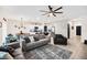Open concept living room, kitchen and dining area with modern decor and stainless steel appliances at 1185 Catskill Dr, Haines City, FL 33844