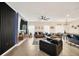 Living area features large television, contemporary accent wall, and open layout at 1185 Catskill Dr, Haines City, FL 33844