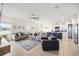 Bright and airy living room blends seamlessly with the kitchen, creating a welcoming atmosphere at 1185 Catskill Dr, Haines City, FL 33844