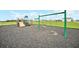 Community playground with swings, slide, and cushioned ground cover in Gathering-friendly neighborhood at 1185 Catskill Dr, Haines City, FL 33844