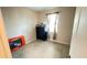 Simple bedroom with tile flooring, natural light, and space for personalization at 14112 Queenside St, Orlando, FL 32824