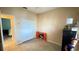 Cozy bedroom featuring tile flooring, closet space, and a neutral color scheme at 14112 Queenside St, Orlando, FL 32824